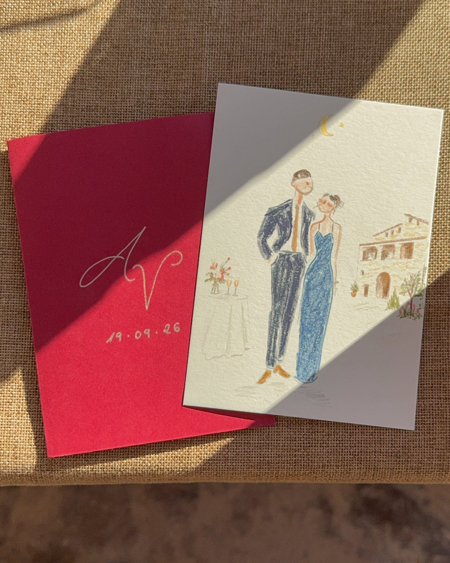 Retrato de una pareja y sobre granate con las iniciales A y V