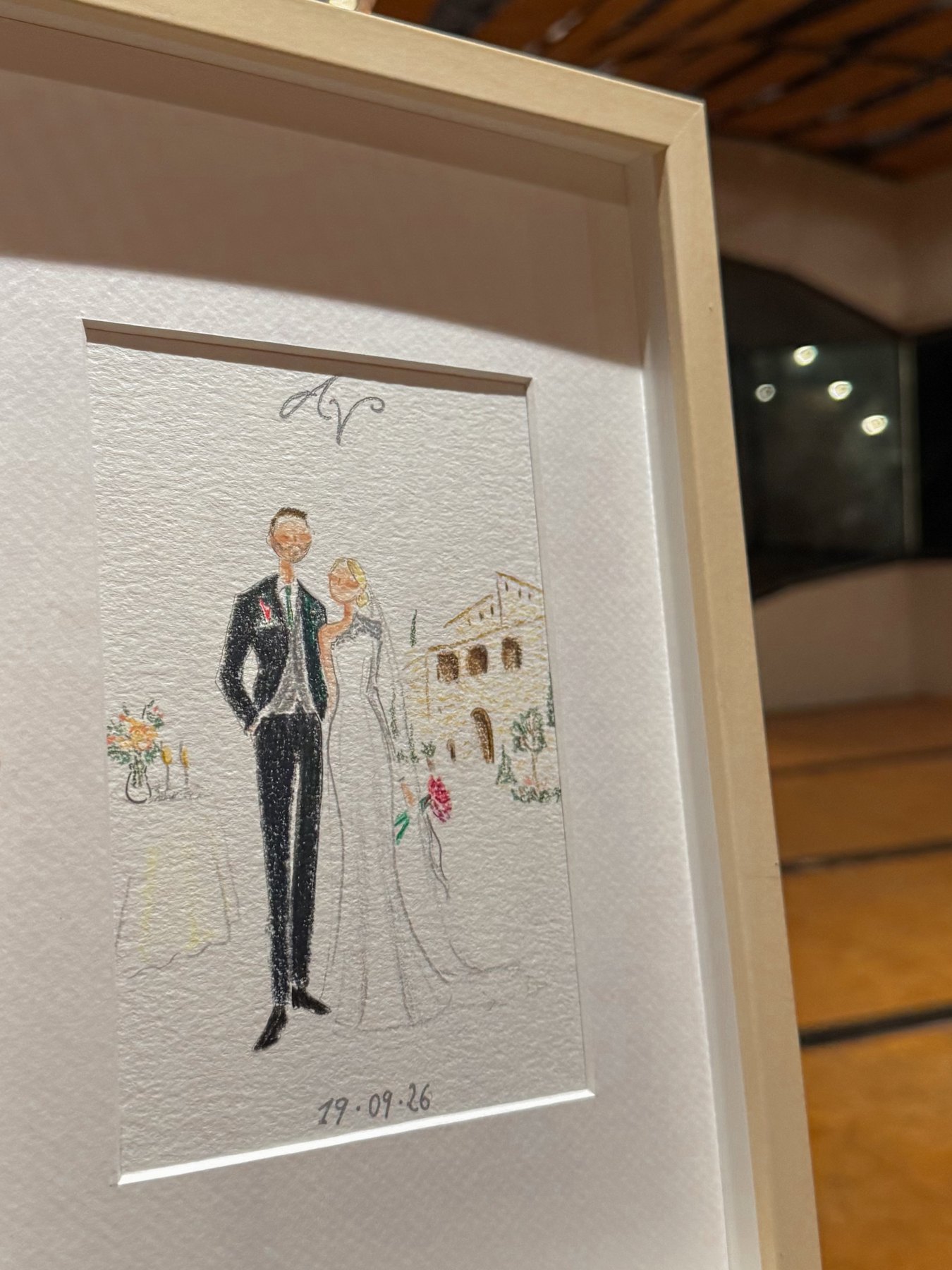 Ilustración enmarcada de Andrea y Víctor con Mas de Pedrafita al fondo